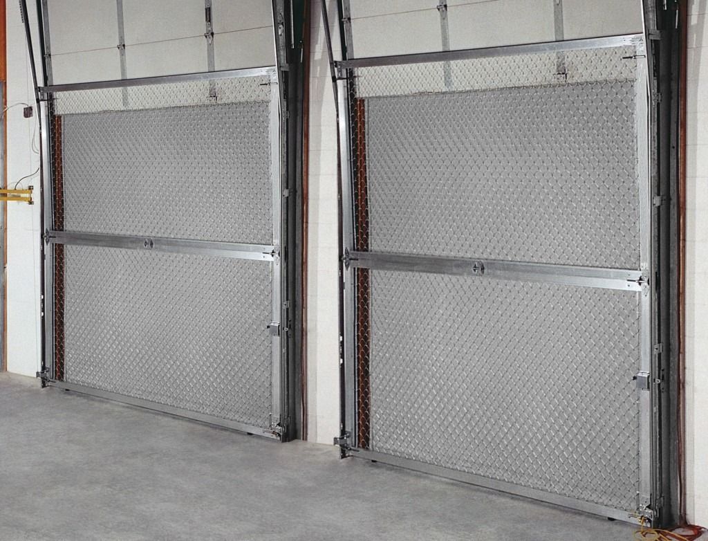 A pair of garage doors are open in a garage