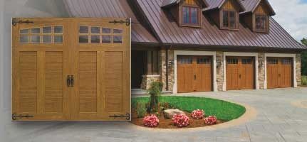 A house with three garage doors and a concrete driveway.