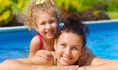 Mother and her daughter in the pool