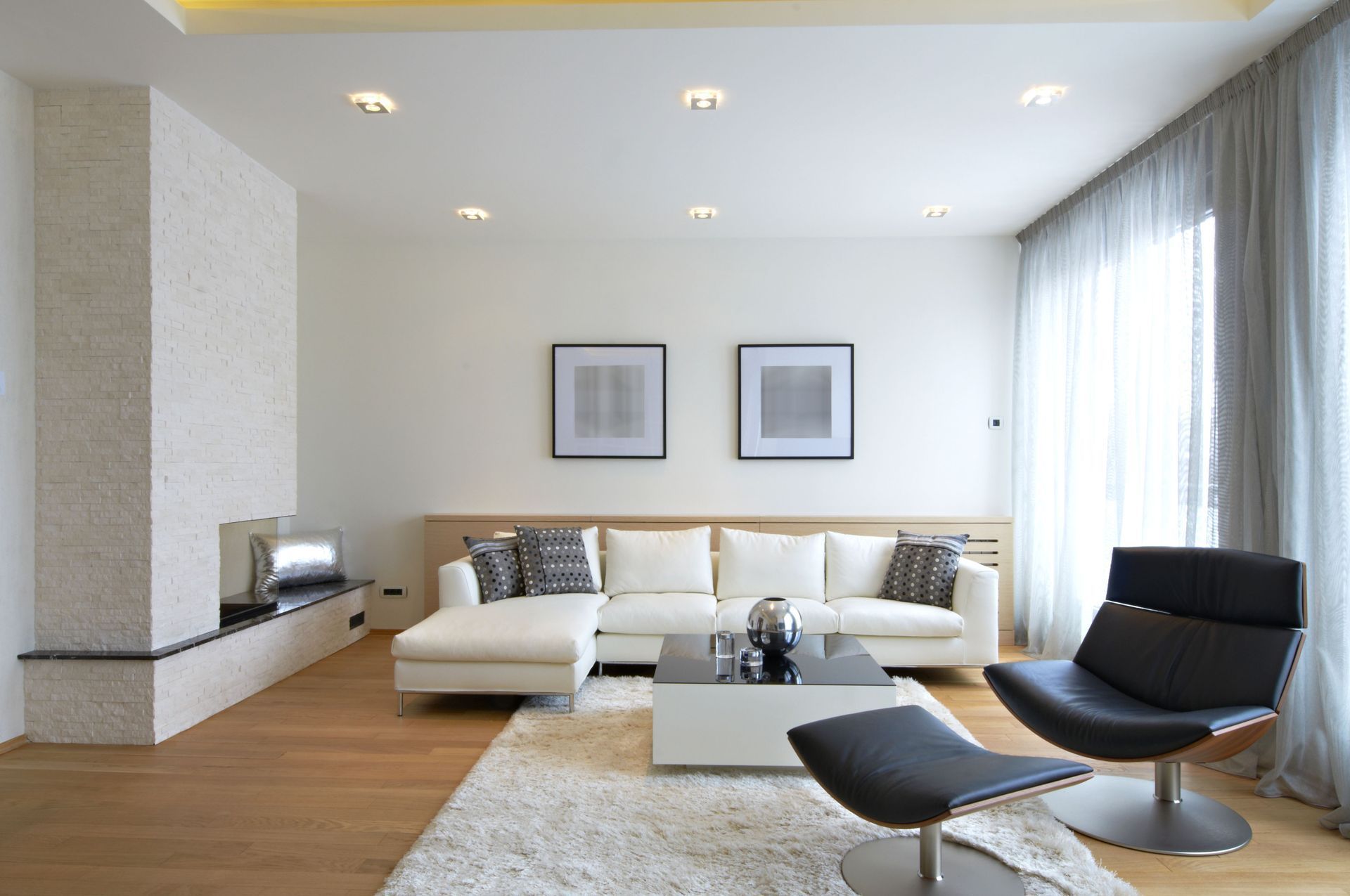 A living room with a couch a chair and a coffee table
