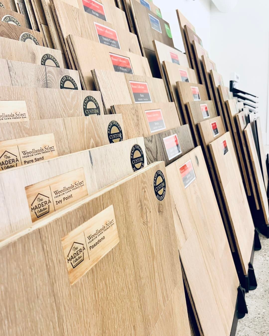 A row of wooden boards stacked on top of each other in a store.