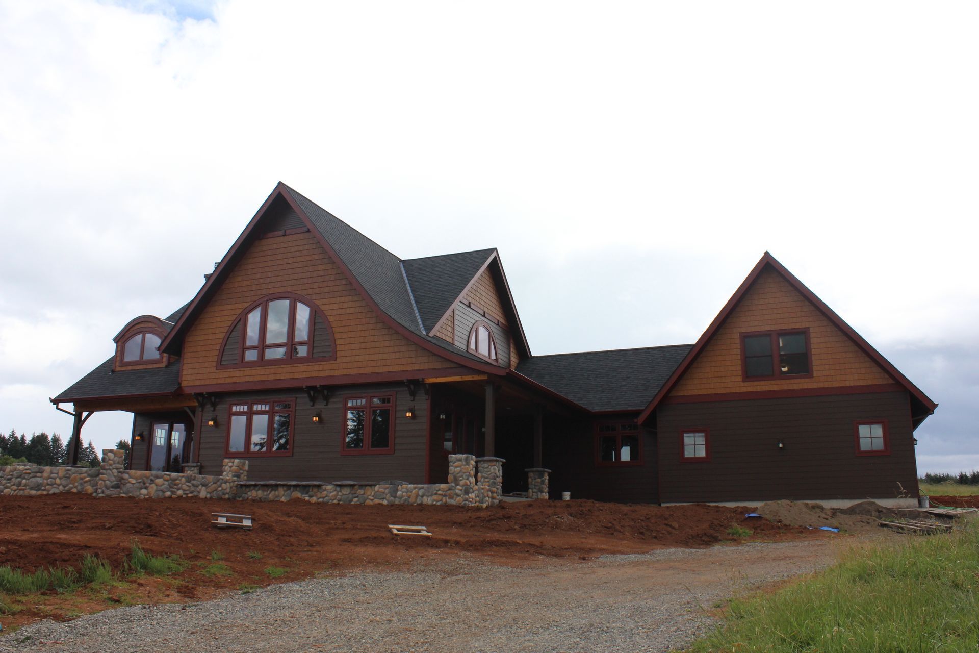 A large house with a lot of windows and a roof