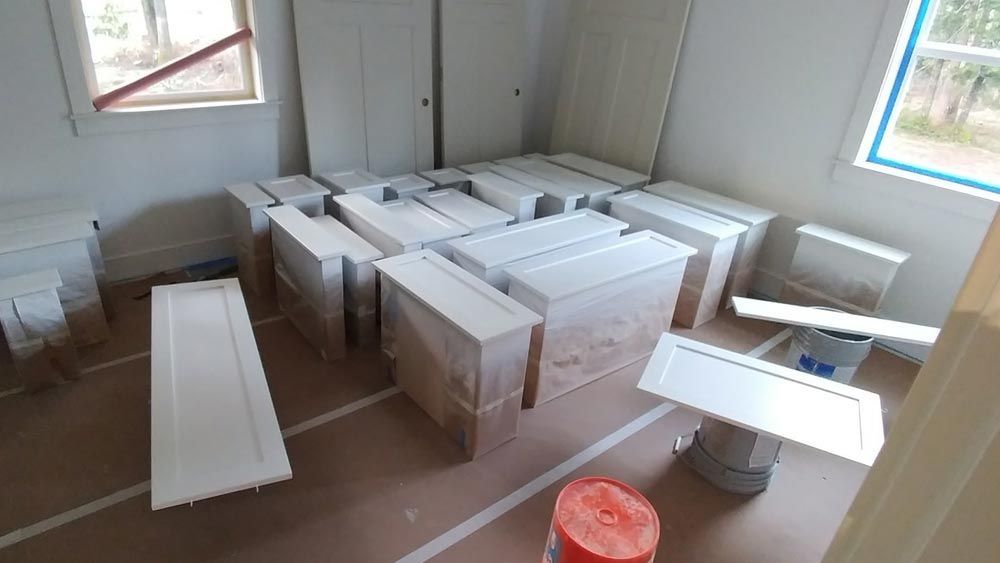 A room with a lot of white boxes on the floor