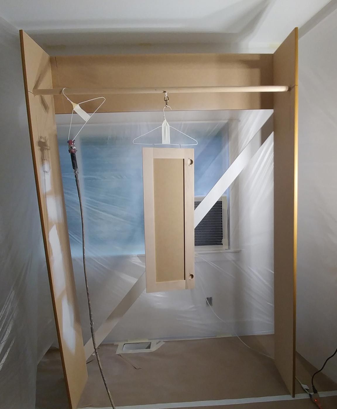 A room with a wooden door and a window