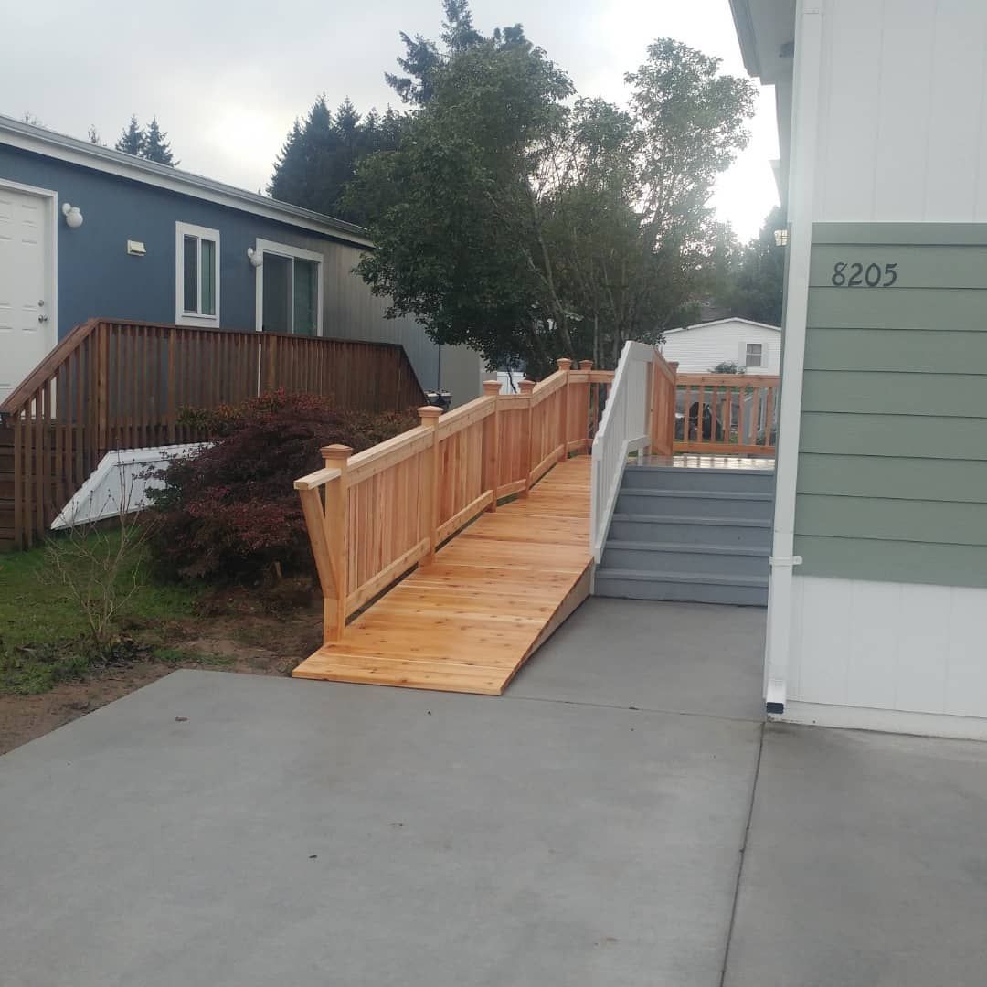 A wooden ramp with stairs leading up to a house