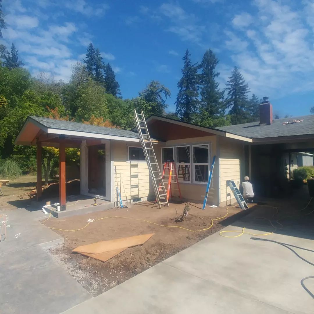 A house under construction with a ladder in front of it