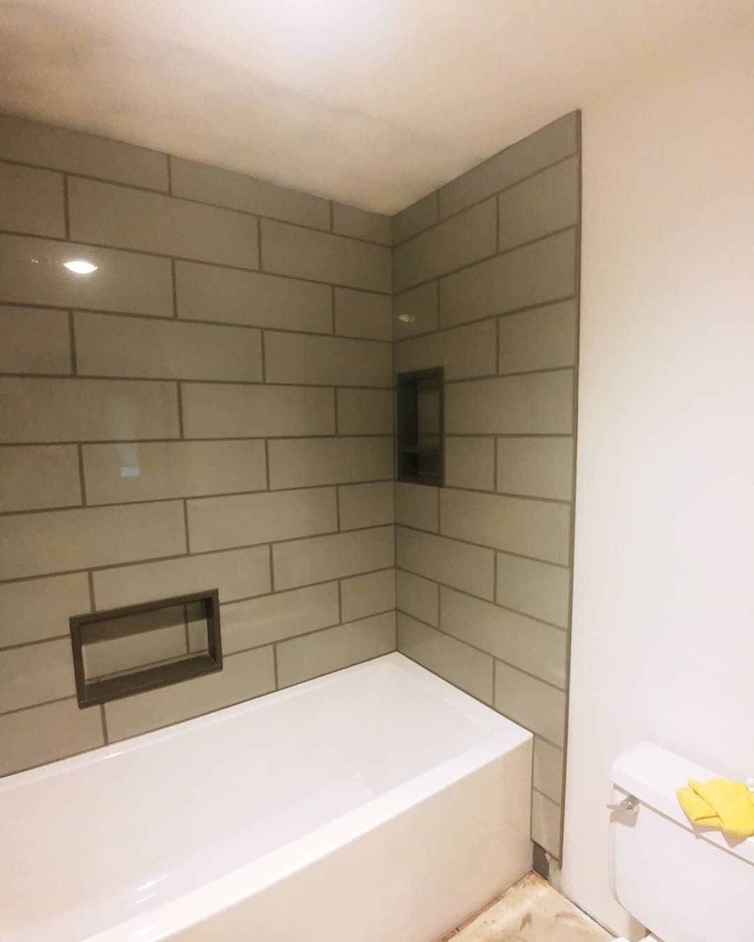 A bathroom with a bathtub and a toilet