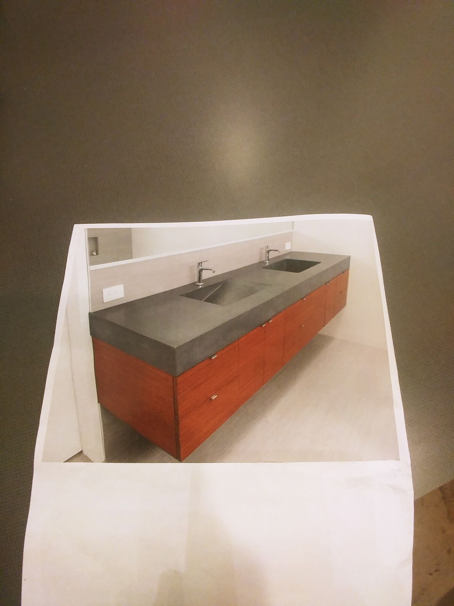 A picture of a bathroom vanity with two sinks