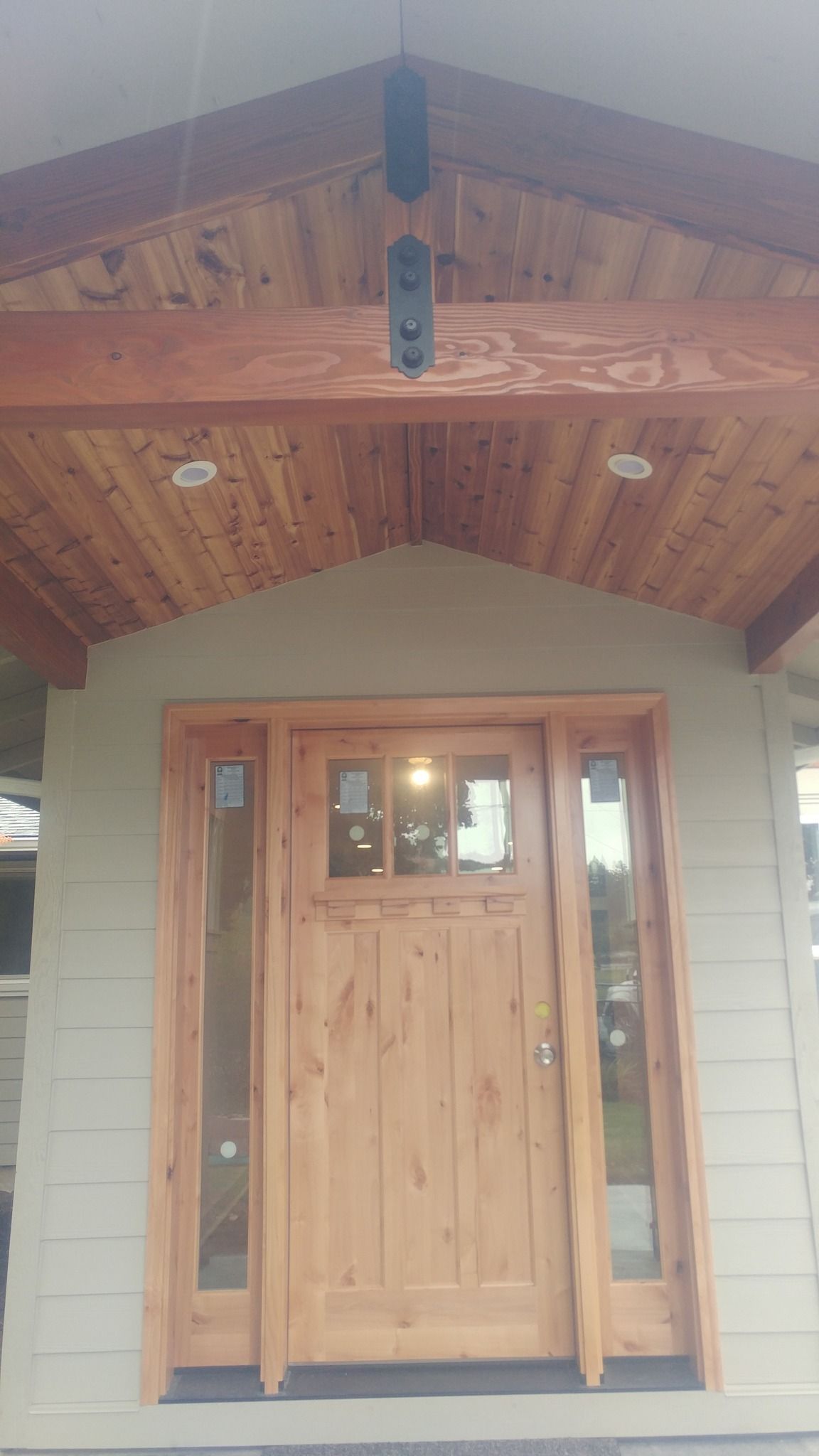 The front door of a house has a wooden door