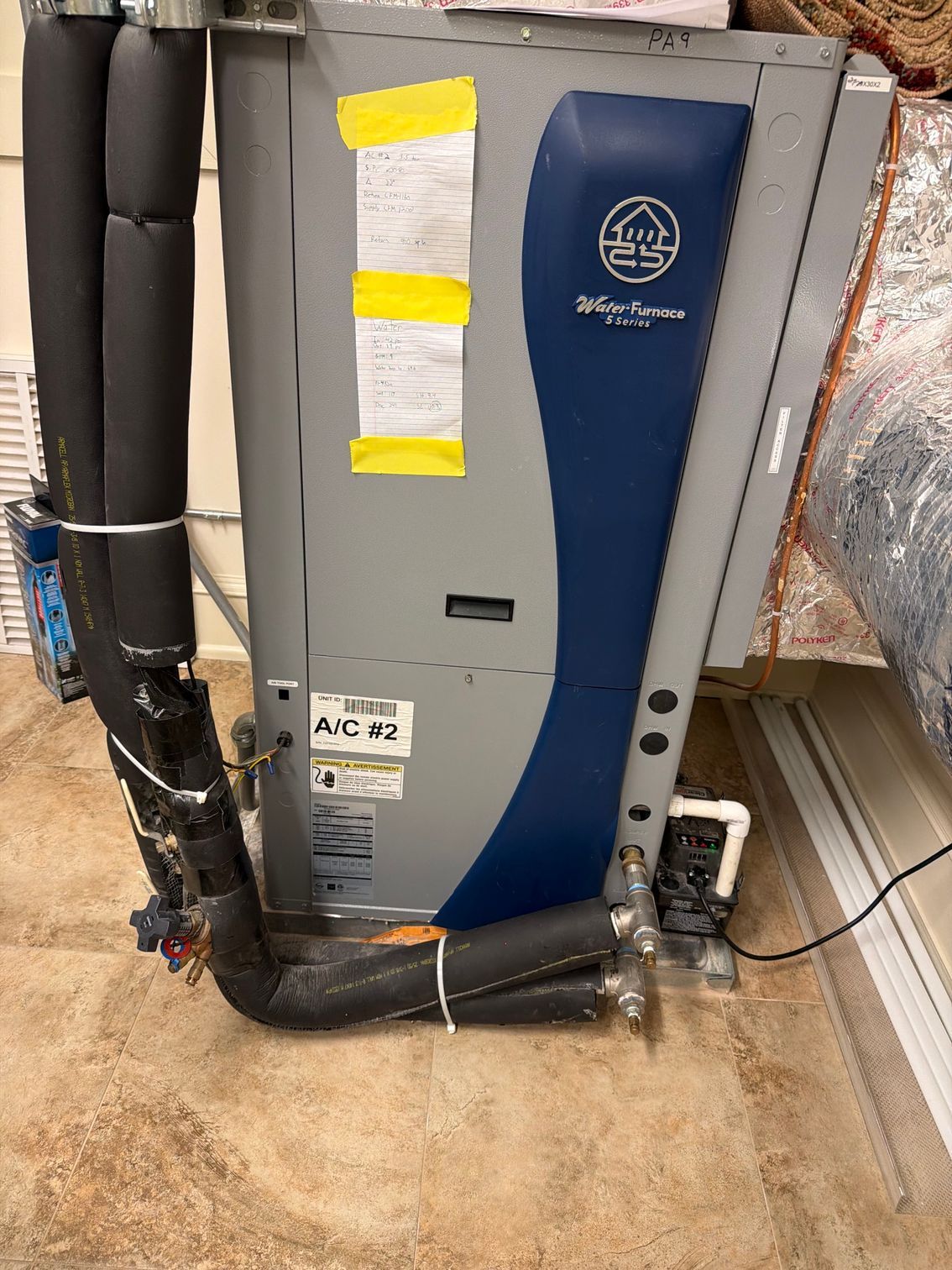 Skyriver HVAC unit with insulated ductwork and foil-wrapped pipe in a utility room