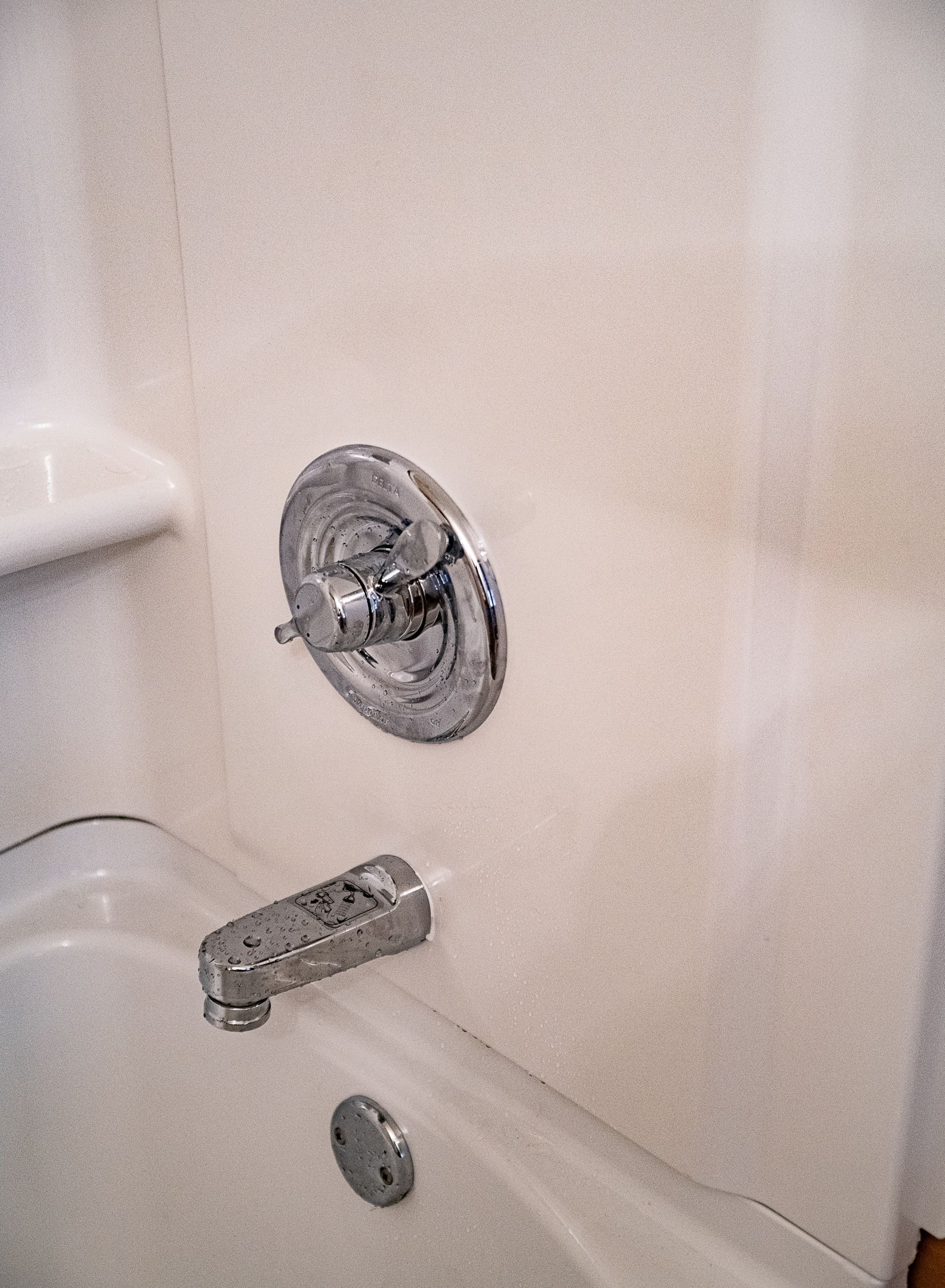 A bathroom with a bathtub and a toilet