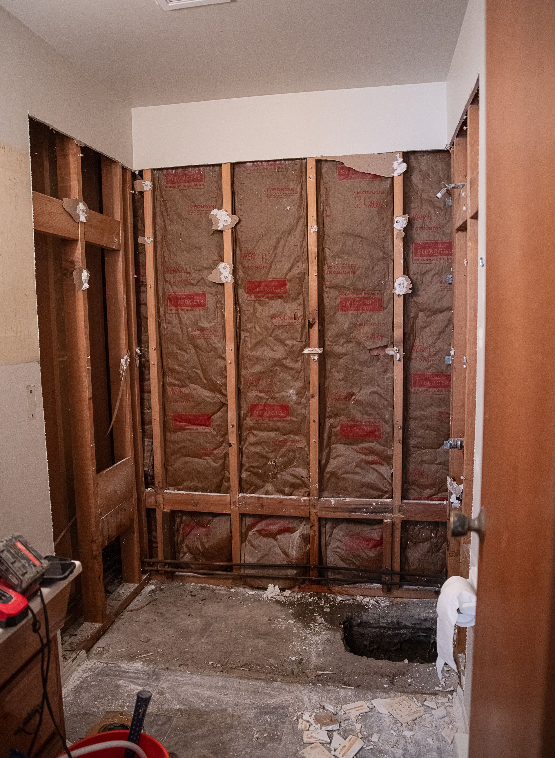 A bathroom that is being remodeled and has a hole in the floor