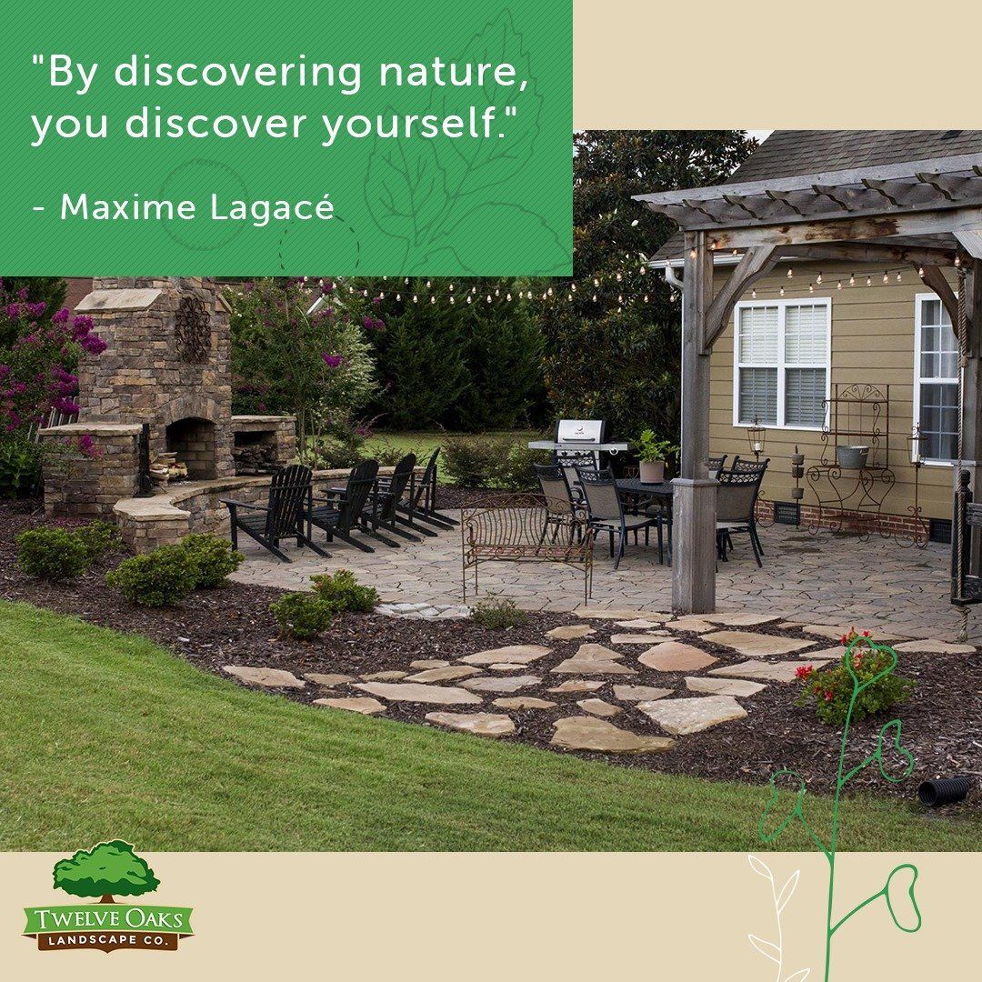 Patio with fireplace, dining area, and landscaping. Quote: 