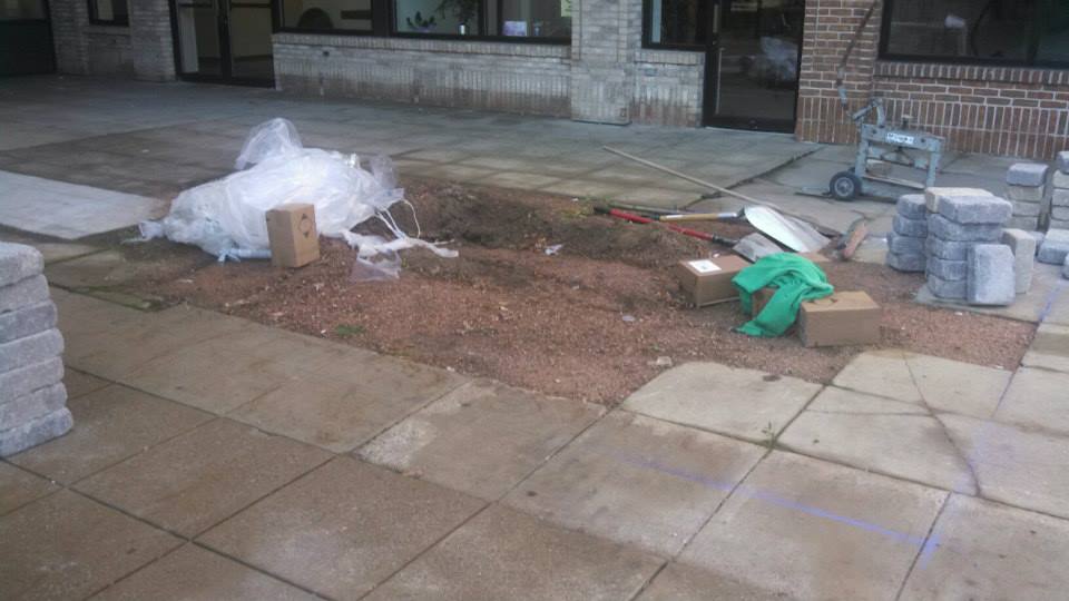 This area would puddle water every time it rained, and it was an eye sore to the shoppes and businesses that looked out on it.