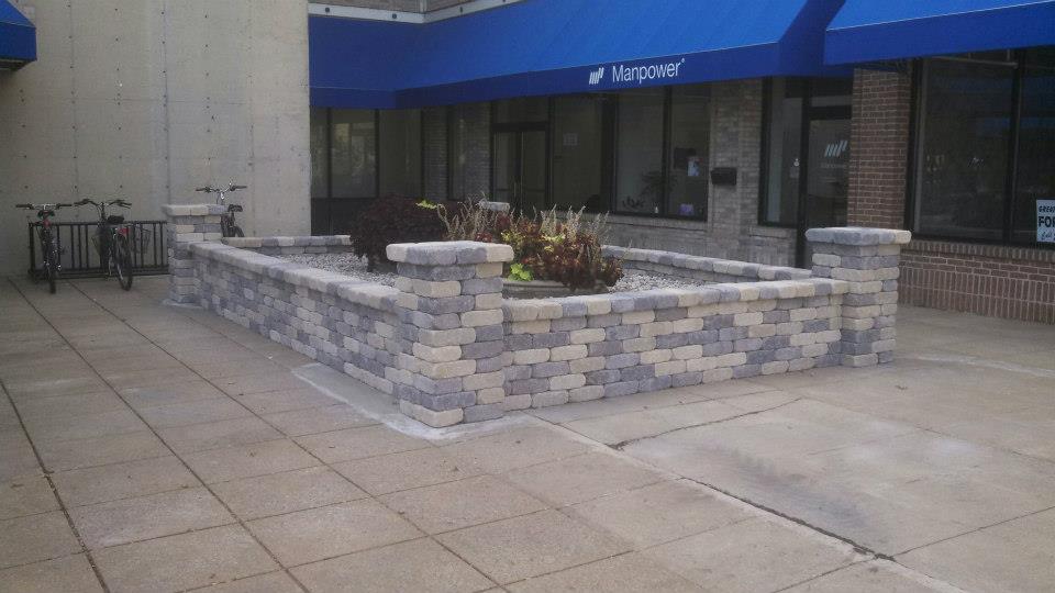 Here is a view if the finished planter with the pots put back into place. The walls are at seat height, so they act as a bench as well.