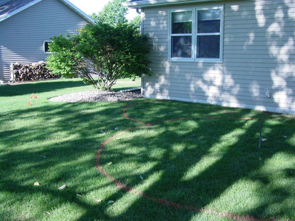 The paint marks the spot for the new patio