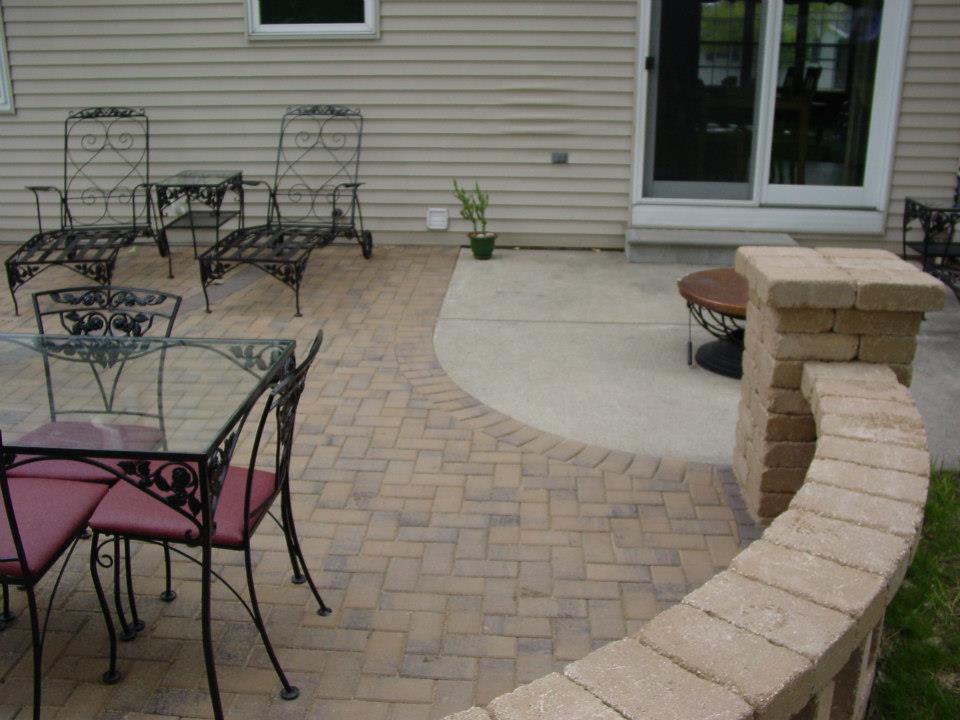 The new patio! Notice the curve cut into the old concrete patio to blend it into the new walls and patios.