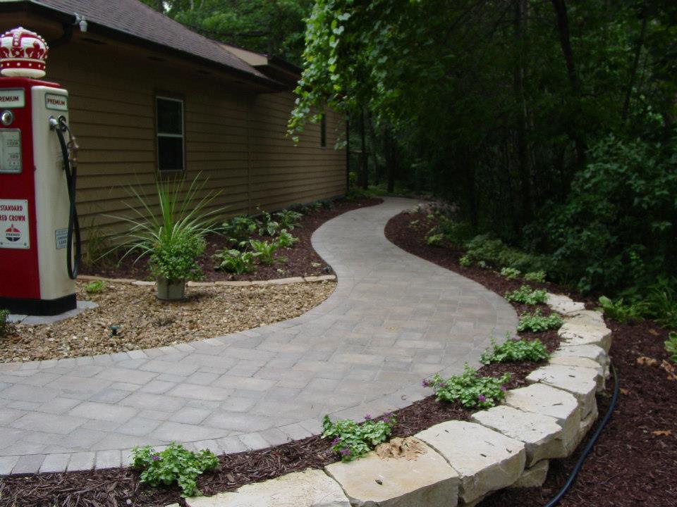 The start of the walk with natural wall stone to hold the grade level.