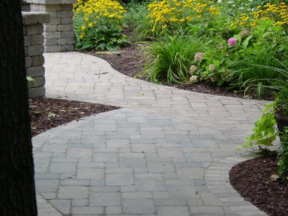 The blending of the walk with the existing patio.