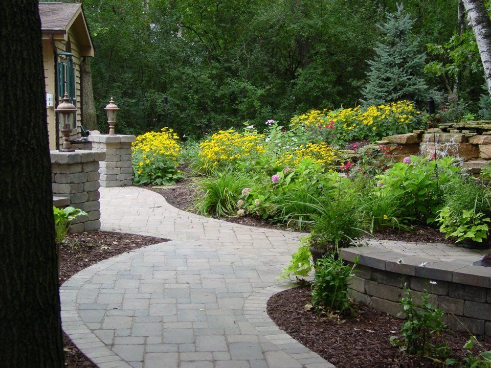 The blending of the walk with the existing patio.