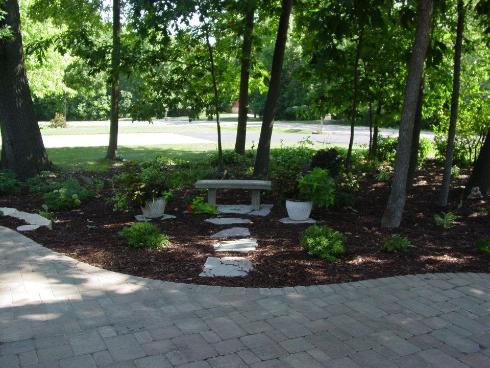 A cozy little sitting area just off the walk and driveway.