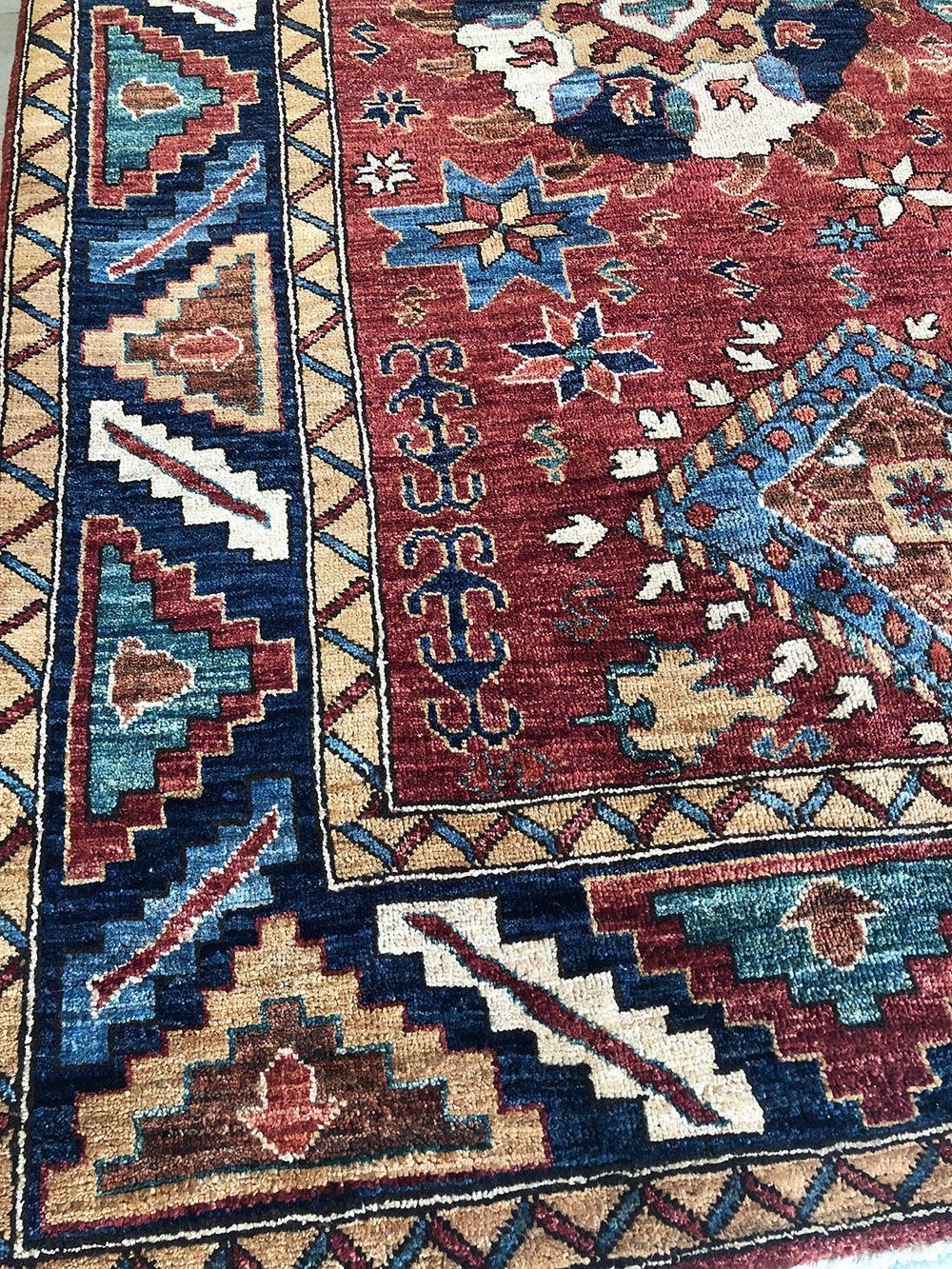 Maroon rug collection close up