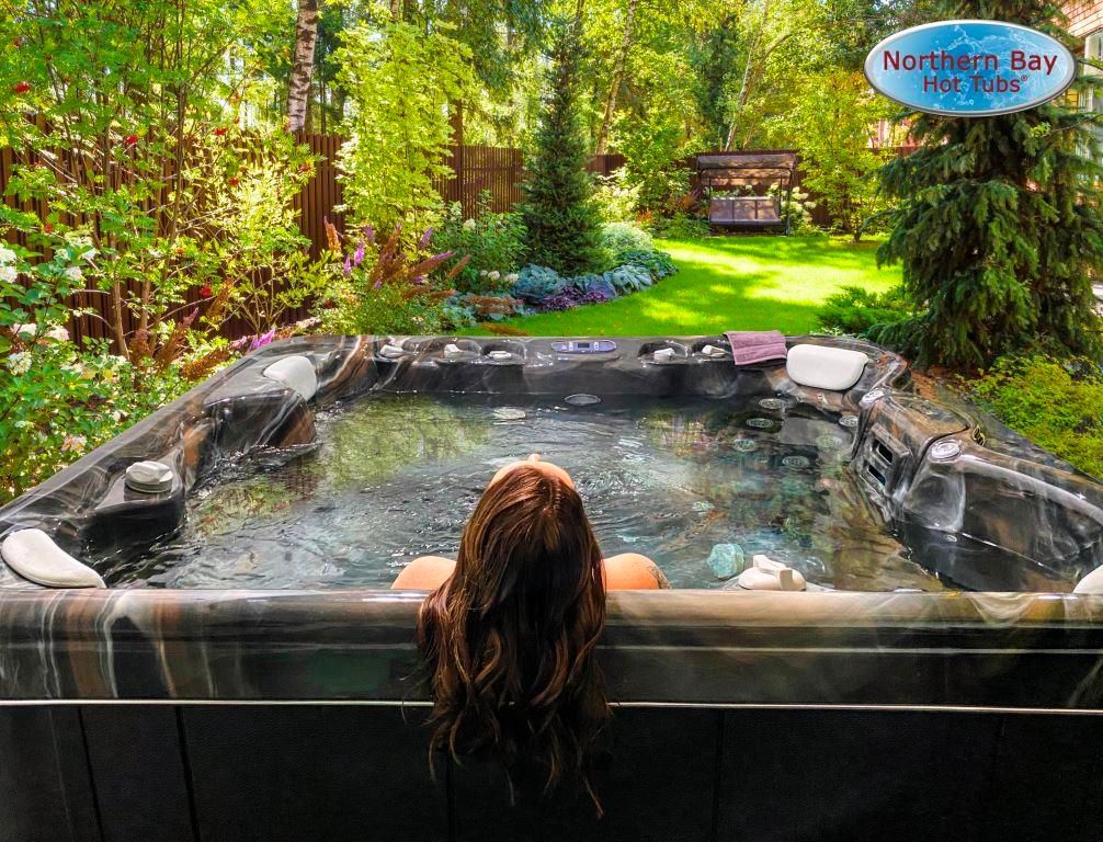 Hot tub in front of the forest.