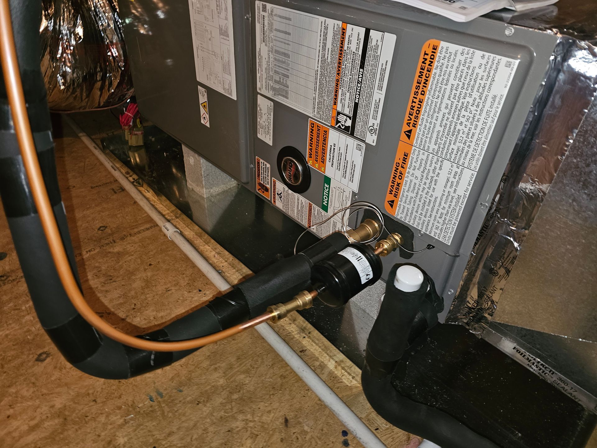 A close up of an air conditioner with a hose attached to it