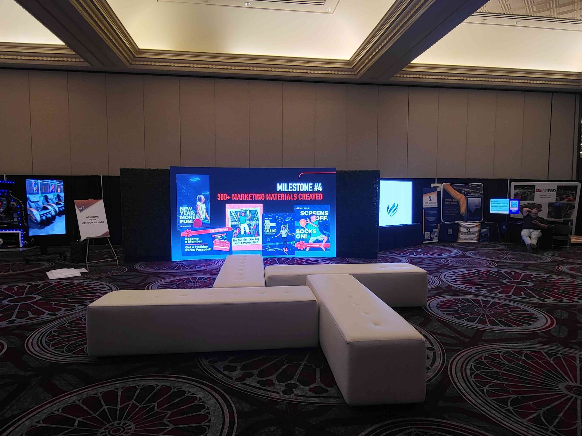 Event setup with large screen displaying 