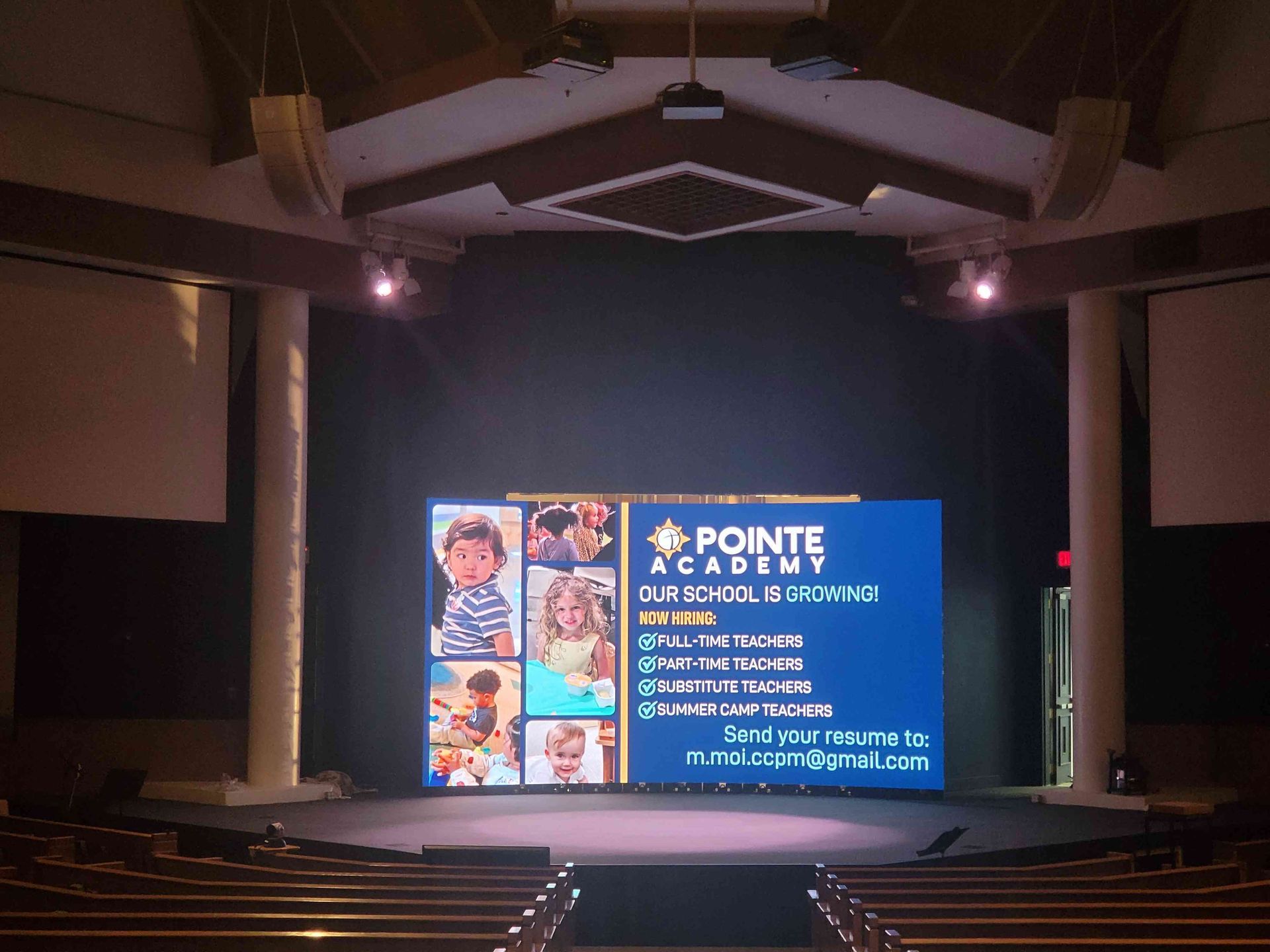 A stage with a large LED screen displaying 