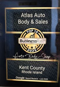 A black and gold award plaque for Atlas Auto Body & Sales, named a top 10 business in Kent County, Rhode Island for 2025.