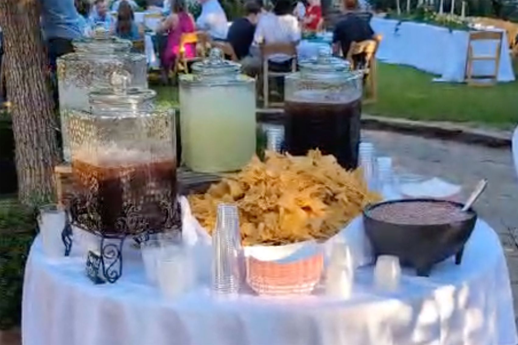 A table with a variety of food and drinks on it.