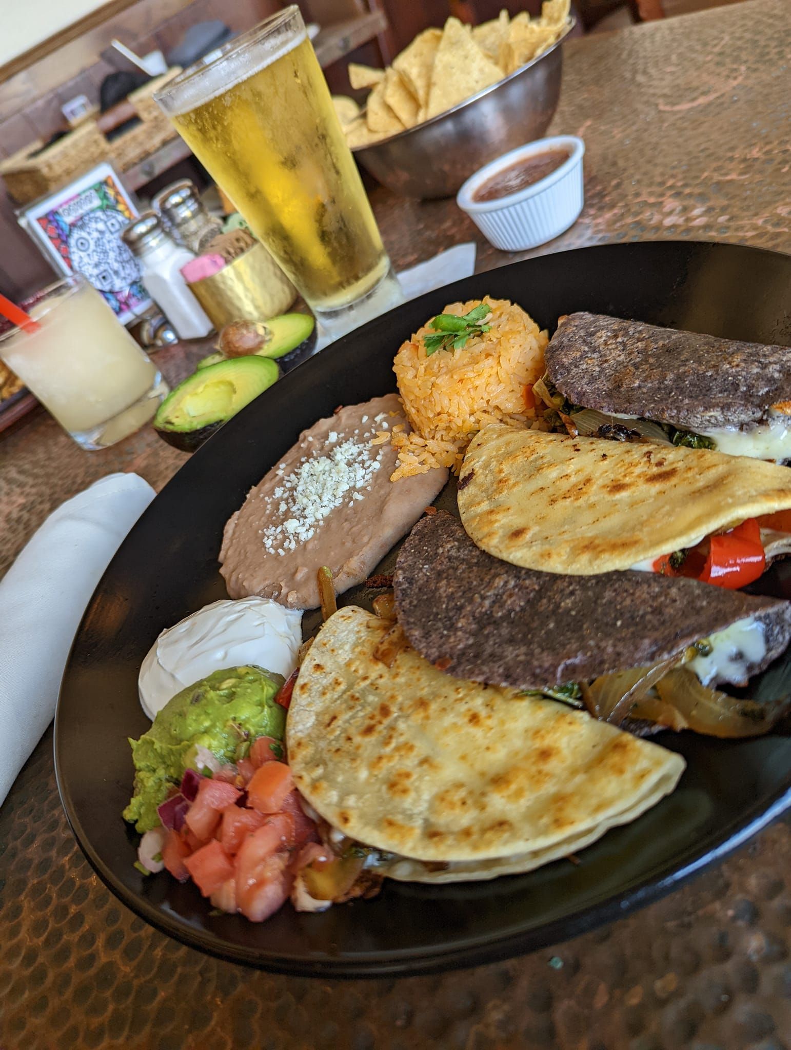 a close up of a plate of Mexican food on a table