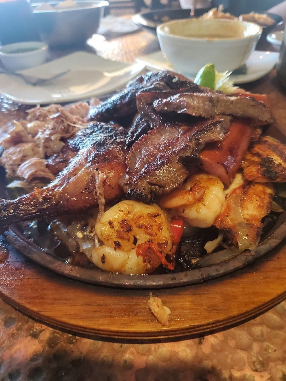 a close up of a plate of food on a wooden table