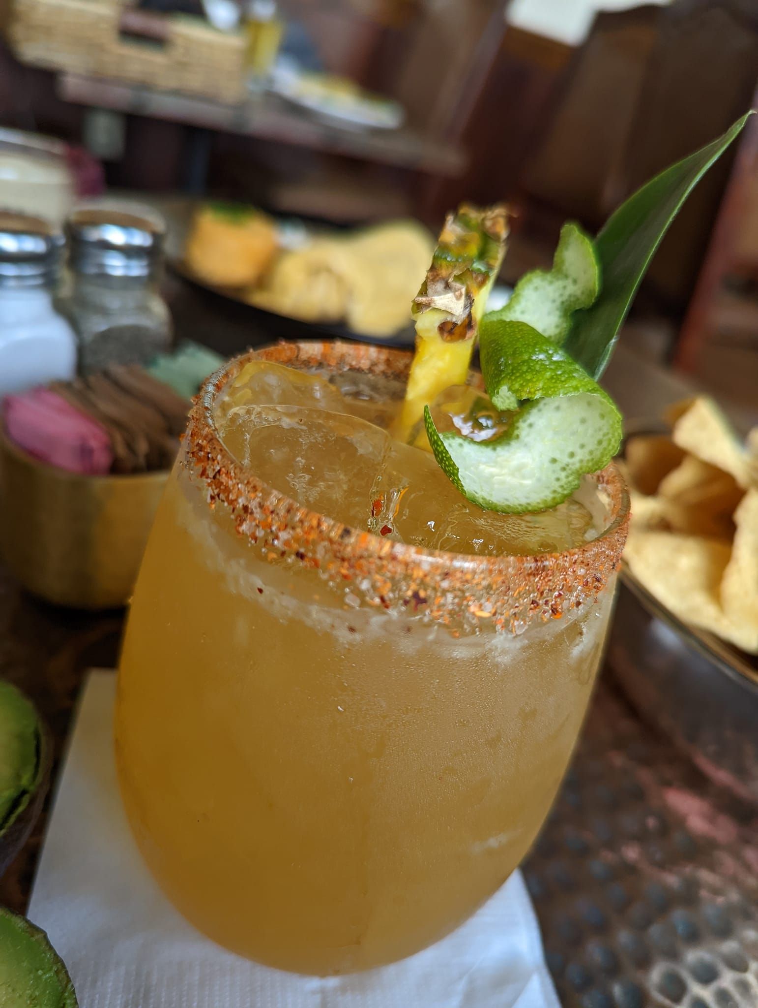 a close up of a drink in a glass on a table