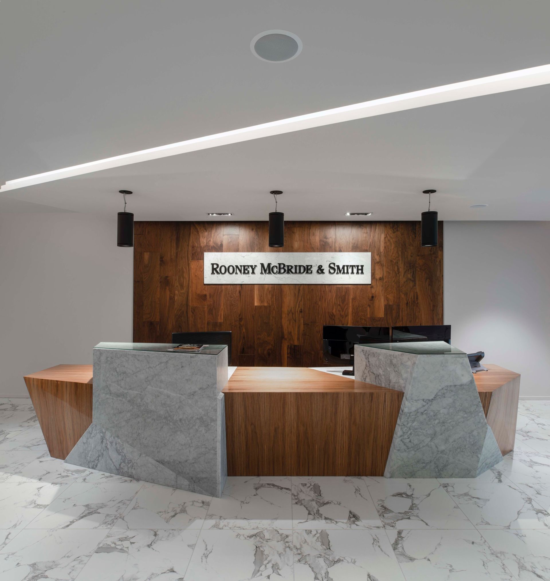 Reception desk with wood and stone accents; 