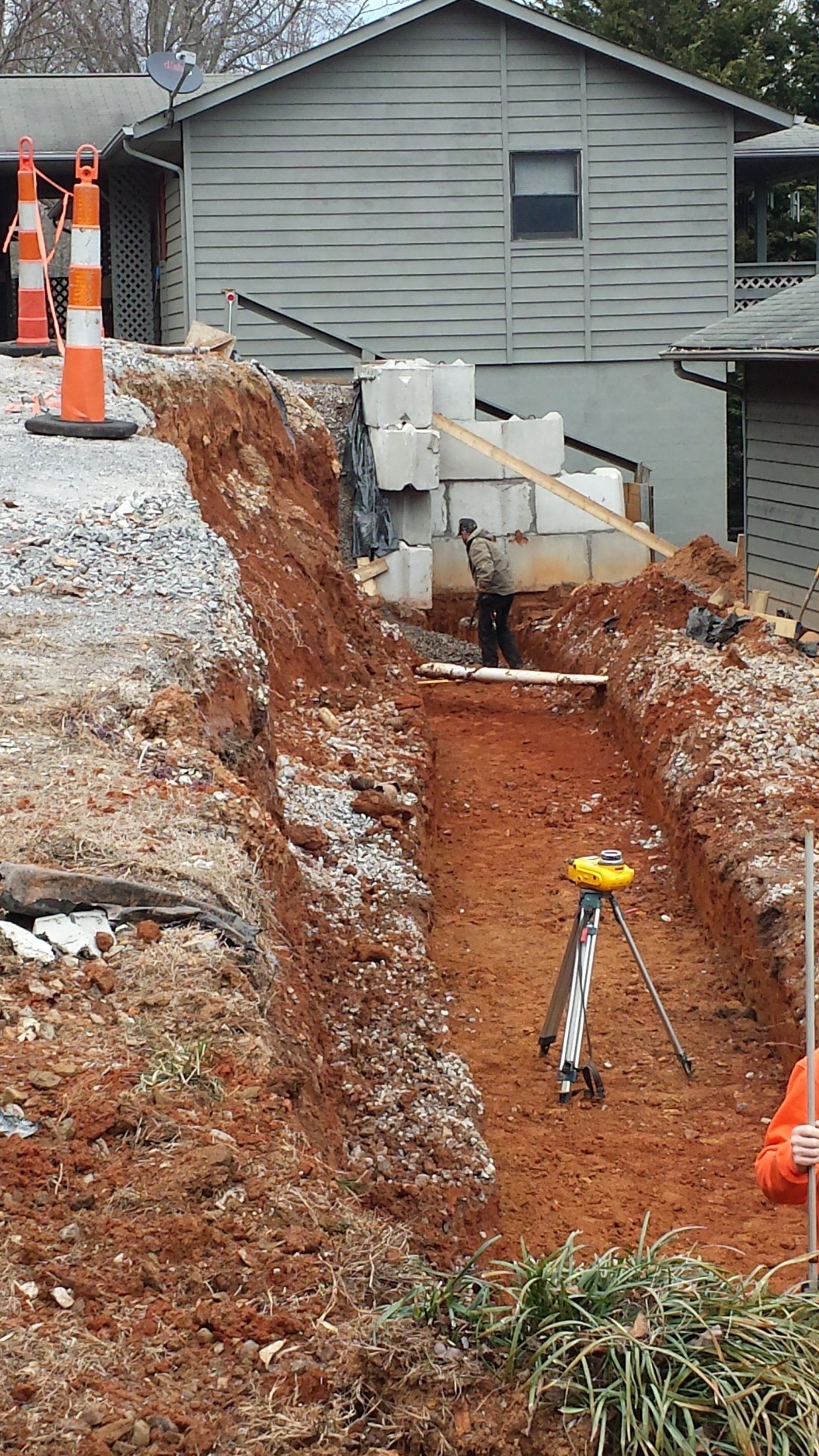 Engineered footer for reconstruction of wall failure