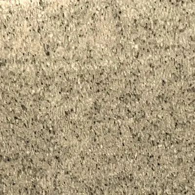 Close-up of a beige speckled textured surface