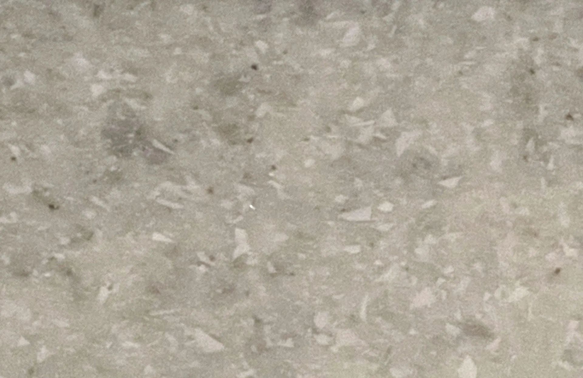 Close-up of a speckled gray stone or concrete surface