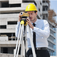 Professional land surveyor check the site