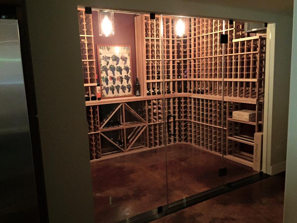 A wine cellar with lots of shelves and bottles of wine