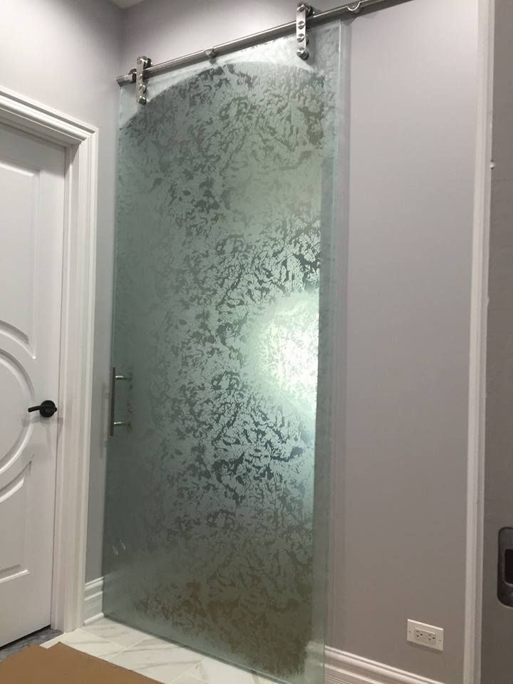 A sliding glass door with a pattern on it