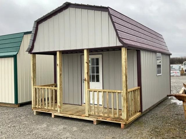 A small house with a porch and a purple roof