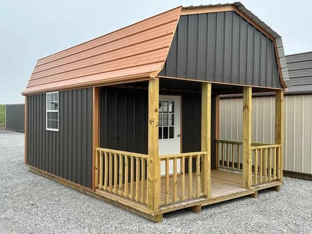 A small cabin with a porch and a window.