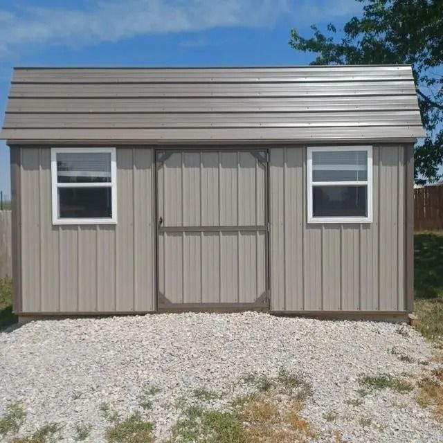A small shed with two windows and a sliding door