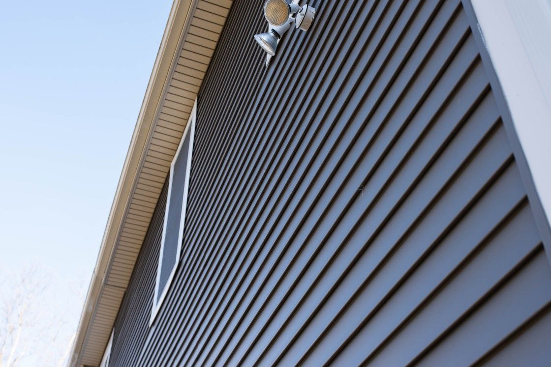 A close up of a house with a blue sky in the background