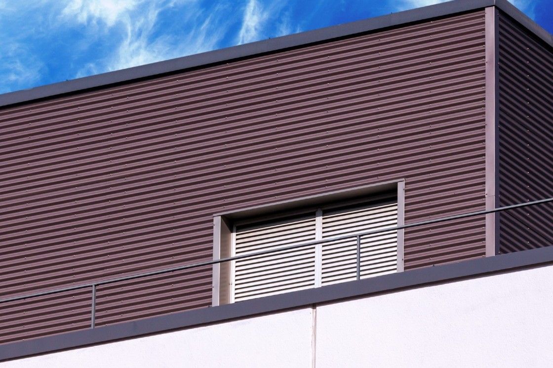A building with a balcony on the top of it