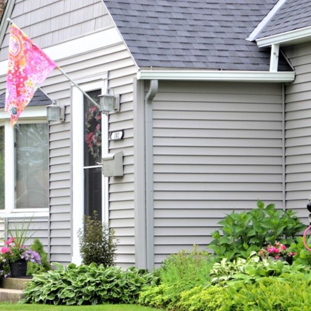 A house with a pink flag in front of it