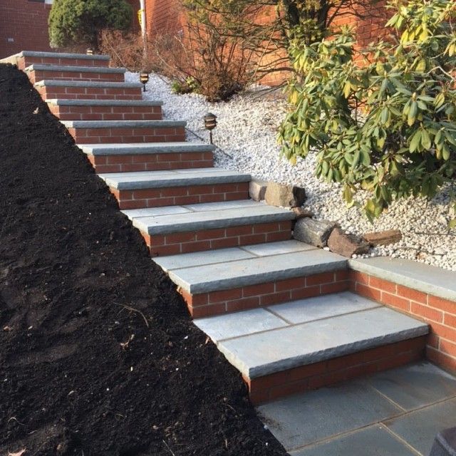 A set of brick steps leading up to a house