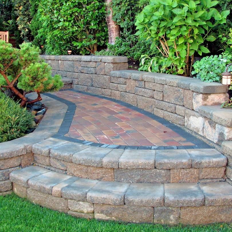 A stone wall with steps leading up to it